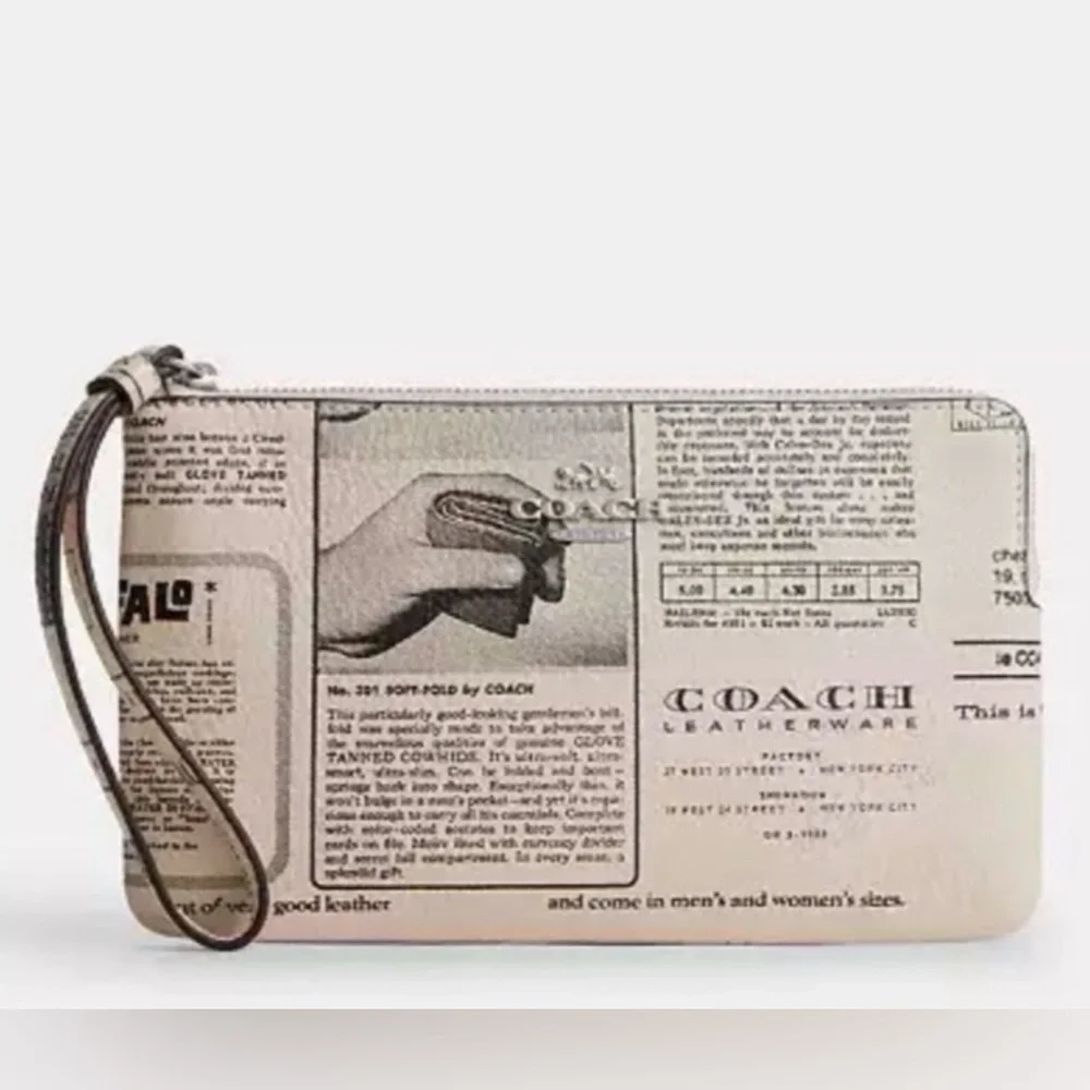 COACH LARGE CORNER ZIP WRISTLET WITH NEWSPAPER PRINT